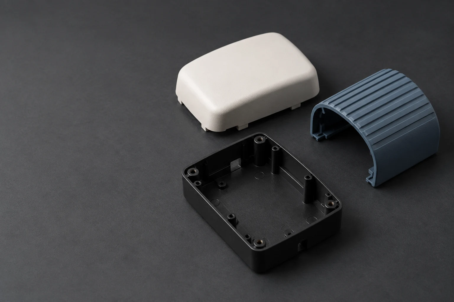Conceptual studio study of unbranded injection-molded enclosure and ribbed cover forms.
